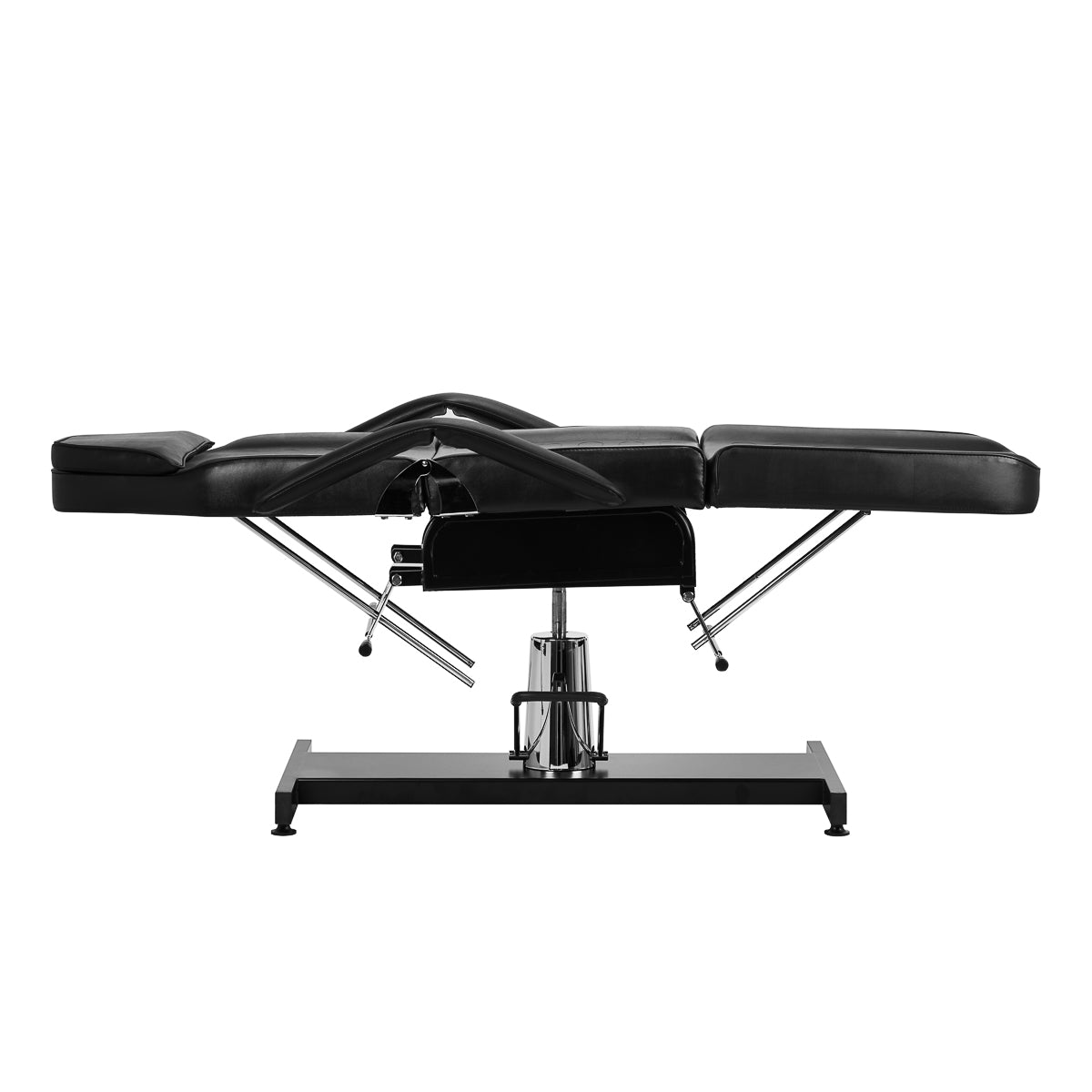 Black hydraulic treatment chair with height adjustment, swivel base, and extendable section on a chrome frame.
