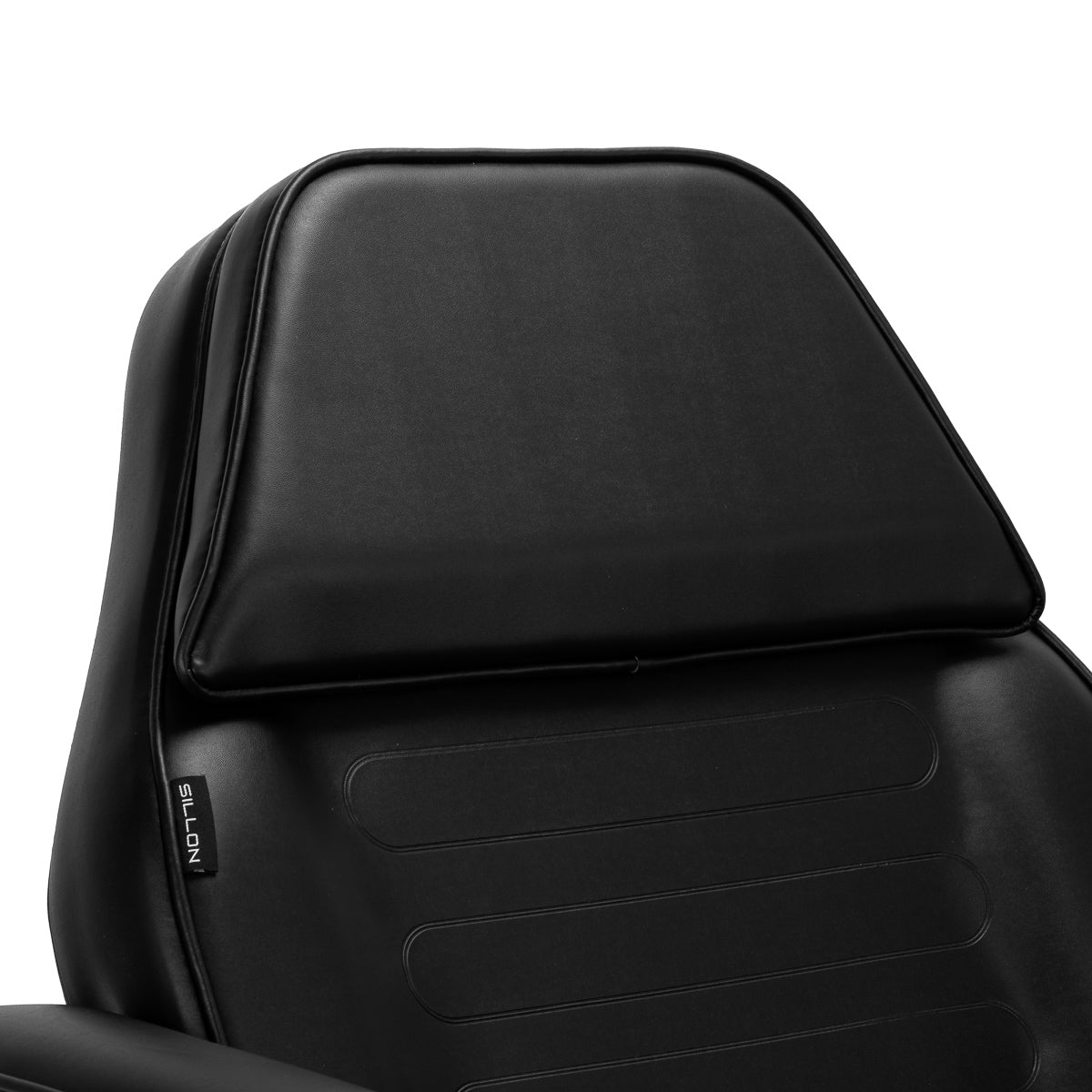 Black hydraulic treatment chair backrest with padded headrest and leather upholstery.