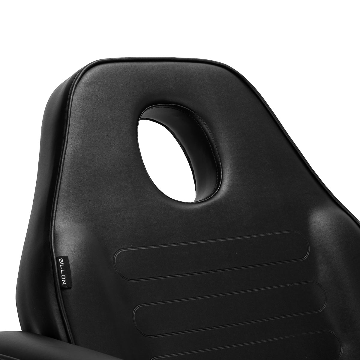 Black hydraulic treatment chair backrest with circular cutout, sleek, stable and versatile.