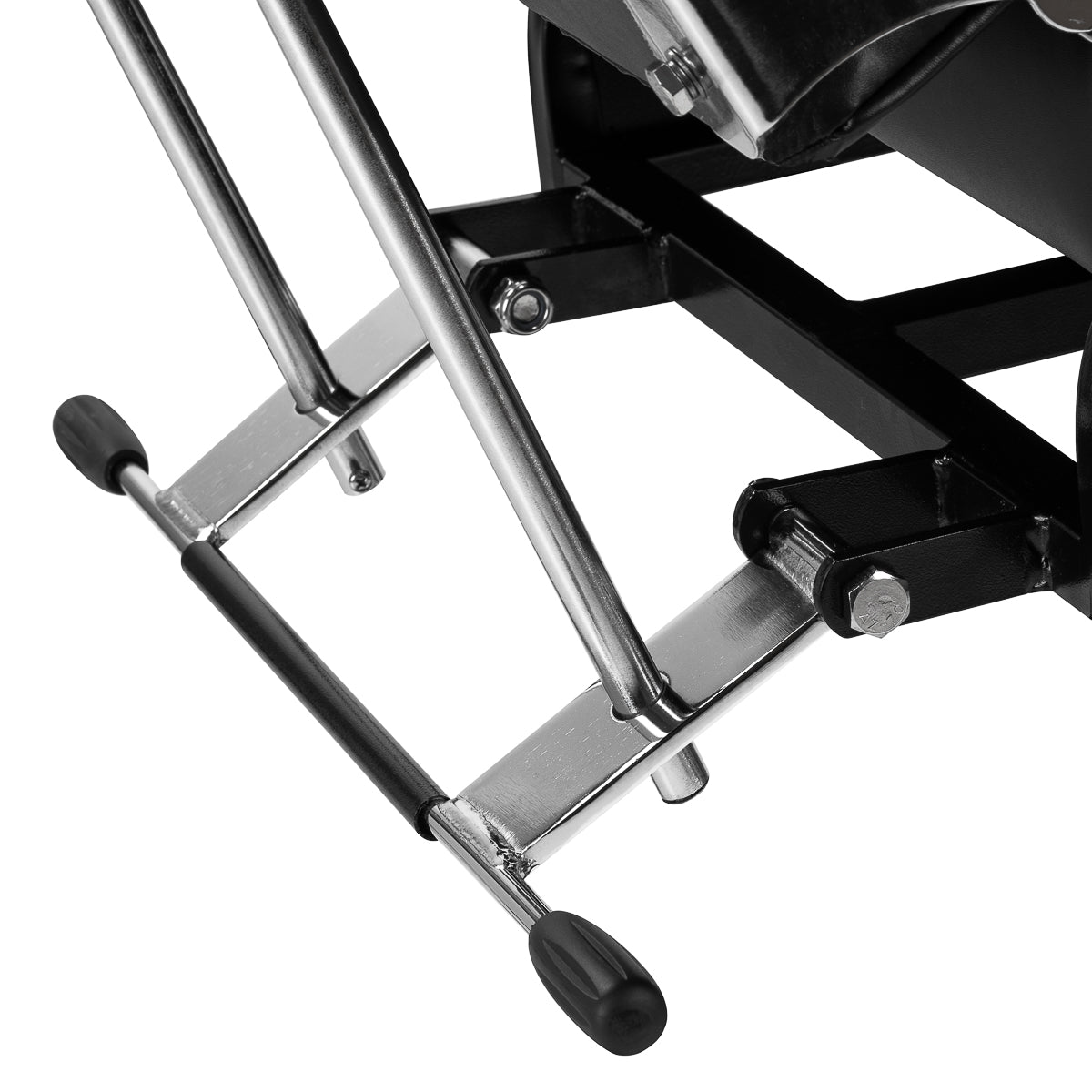Black hydraulic treatment chair with chrome frame, adjustable height and swiveling base.